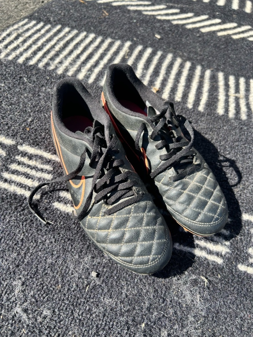 Nike women’s  Black Athletic Quilted Soccer/Training Cleats with Orange Swoosh